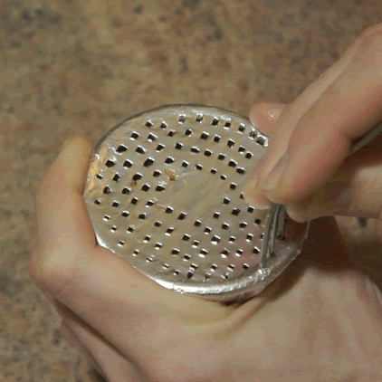 Poking holes in a hookah bowl using a fork